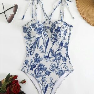 NWT blue and white print swimsuit.